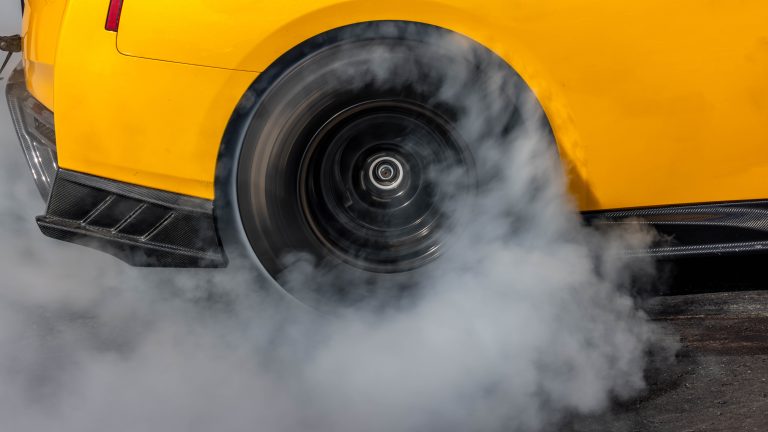Car burnout wheels tire with white smoke,Car wheel burnout with